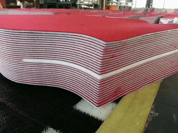 Multi-layer fabric cutting machines